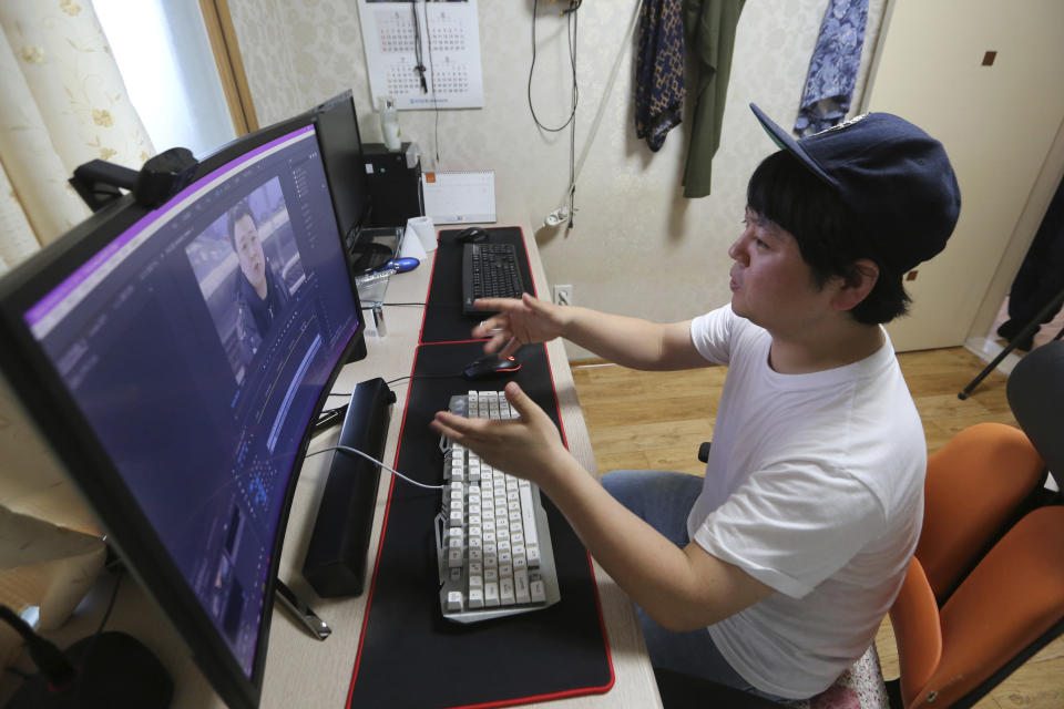 In this July 18, 2019, photo, North Korean refugee Jang Myung-jin edits his YouTube footage during an interview at his house in Seoul, South Korea. The 32-year-old Jang is among a handful of young North Korean refugees in South Korea who have launched YouTube channels that offer a rare glimpse into the everyday lives of people in North Korea, one of the world’s most secretive and repressive countries. (AP Photo/Ahn Young-joon)