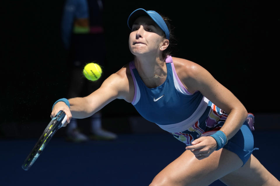 Belinda Bencic of Switzerland plays a forehand return to Aryna Sabalenka of Belarus during their fourth round match at the Australian Open tennis championship in Melbourne, Australia, Monday, Jan. 23, 2023. (AP Photo/Aaron Favila)