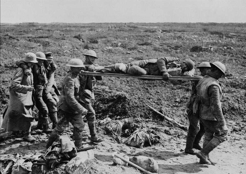 <p>Aid workers and German prisoners help transport wounded soldiers from Vimy Ridge in April 1917. Photo from CP. </p>