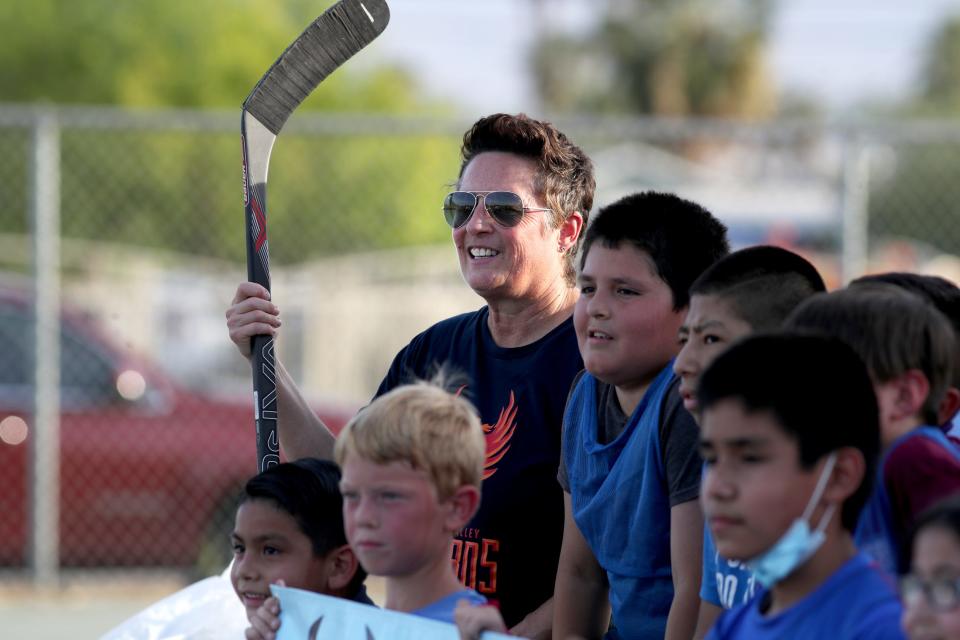 Former Olympic hockey coach Shannon Miller, left, poses for a group photo during the Coachella Valley Firebirds and Acrisure Arena street hockey clinic at Mecca Community Park in Mecca, Calif., on Monday, May 23, 2022. 