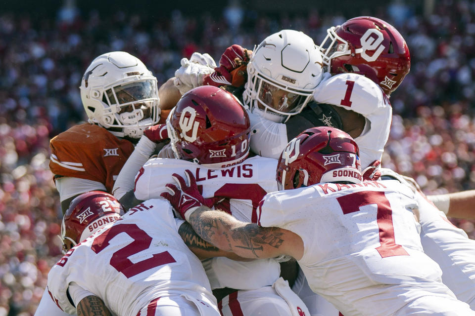 The Oklahoma defense stands up Texas running back Jonathon Brooks on a key goal line stand during the second half of an NCAA college football game at the Cotton Bowl, Saturday, Oct. 7, 2023, in Dallas. Oklahoma won 34-30. (AP Photo/Jeffrey McWhorter)