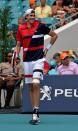 Mar 31, 2019; Miami Gardens, FL, USA; John Isner of the United States reacts after suffering an apparent injury in a match against Roger Federer of Switzerland (not pictured) during the men's finals at Miami Open Tennis Complex. Steve Mitchell-USA TODAY Sports