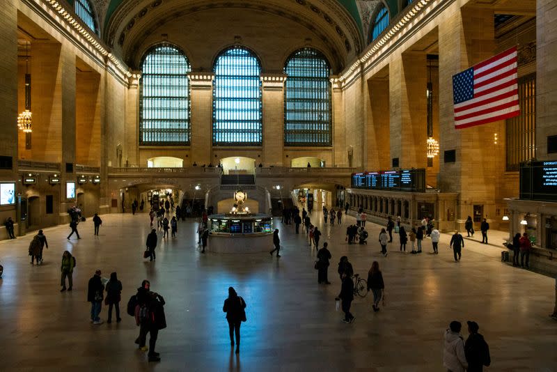 People walk around a non-congested Gran Central Terminal due to coronavirus disease (COVID-19) in New York City, New York