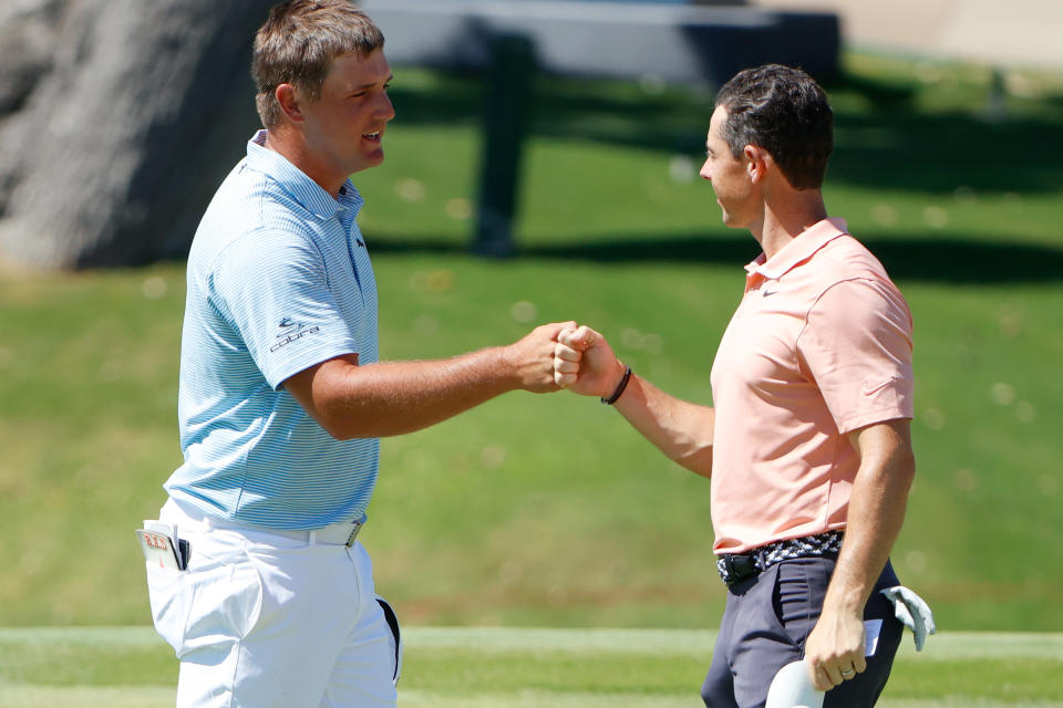 Bryson DeChambeau and Rory McIlroy, here in 2020, will meet again on the golf course this December. (Tom Pennington/Getty Images)