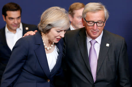 Britain's Prime Minister Theresa May talks to European Commission President Jean-Claude Juncker during a European Union leaders summit in Brussels, Belgium, October 20, 2016. REUTERS/Francois Lenoir