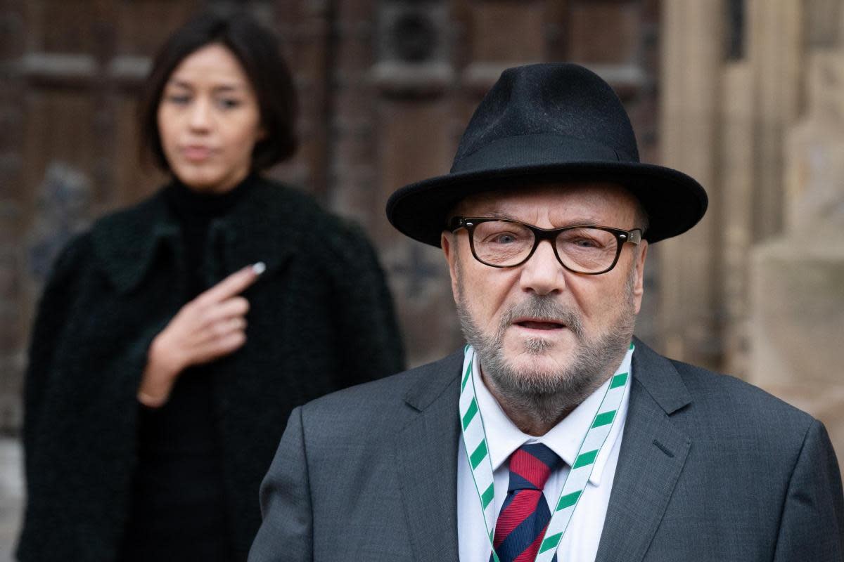 George Galloway, with his wife Putri Gayatri Pertiwi, speaks to the media outside the Houses of Parliament in Westminster <i>(Image: Stefan Rousseau)</i>