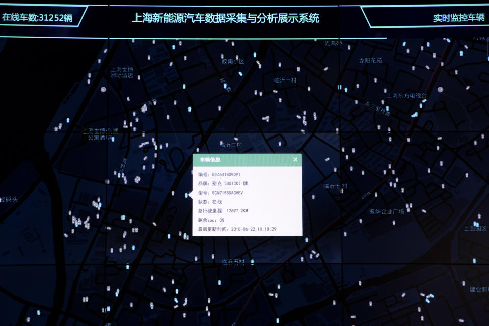 In this Friday, June 22, 2018, photo, a dialog box shows details of a vehicle from amongst thousands tracked and displayed at the Shanghai Electric Vehicle Public Data Collecting, Monitoring and Research Center in Shanghai. According to specifications published in 2016, every electric vehicle in China transmits data from the car's sensors back to the manufacturer. From there, automakers send 61 data points, including location and details about battery and engine function to local centers like this one in Shanghai. (AP Photo/Ng Han Guan)