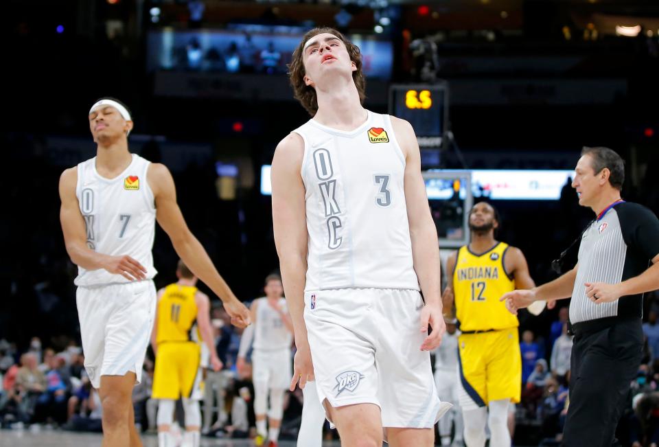 Thunder guard Josh Giddey (3) and Darius Bazley (7) react in the final seconds of a 113-110 overtime loss to the Pacers on Friday at Paycom Center.