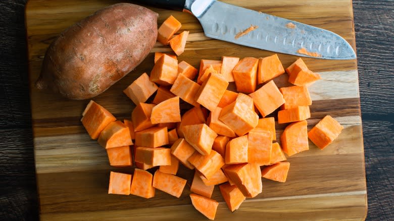 cubed sweet potatoes on board