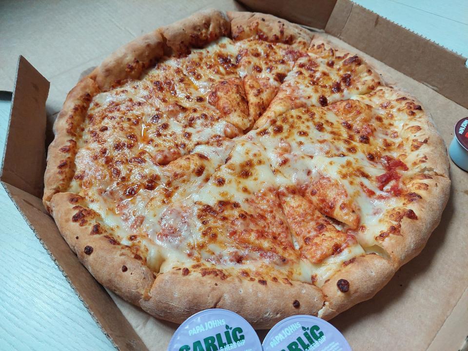 Cheese and tomato pizza from Papa John's, displayed in a box