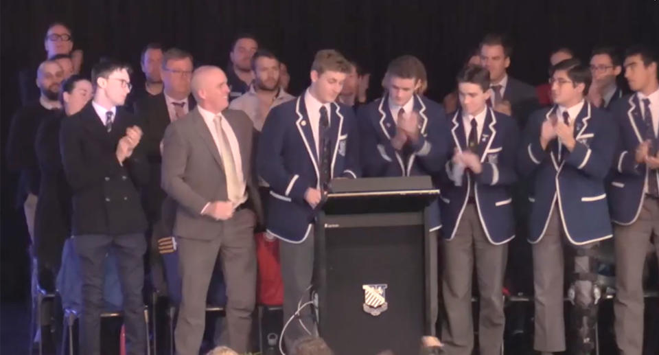 The teenager received a standing ovation from the crowd at St Ignatius, Riverview. Image: SBS News