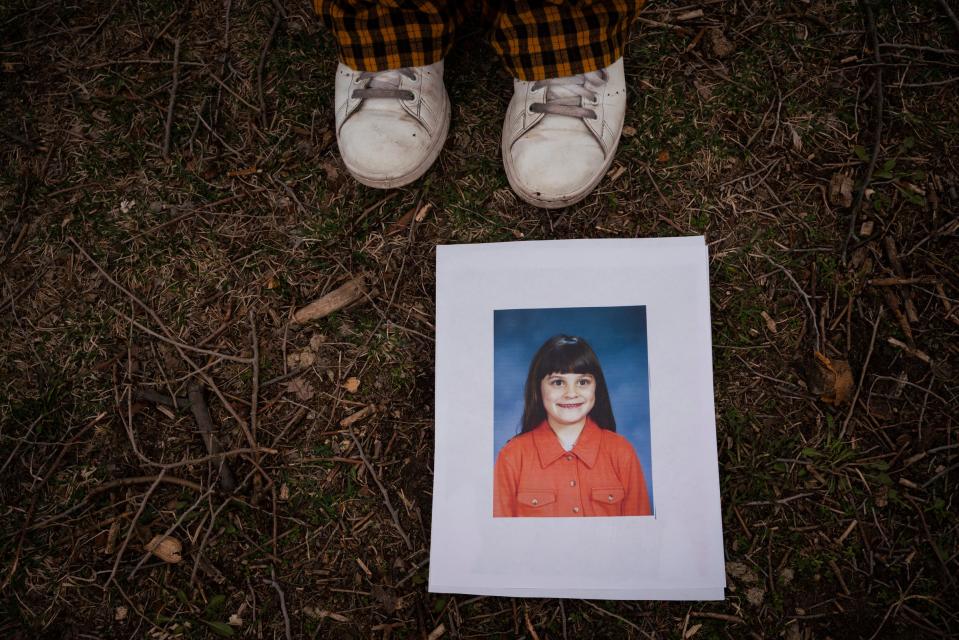 Ashley Marchuck, 32, stands beside a second grade photo of herself at Heritage Park in Taylor on Friday, March 24, 2023. "A lot of people that get diagnosed later in life will trigger a mental health crisis and that's what happened to me. I was having a lot of anxiety attacks and took a leave from work. I realized it was actually a sensory issue," said Marchuck, who was unaware she was autistic until a couple months before her diagnosis. "There are a lot of people that maybe don't realize they are autistic and may be struggling. I'm still learning."