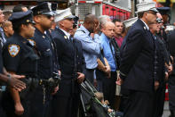 <p>Members of the FDNY and NYPD stand as members drape purple and black bunting on the exterior of the firehouse where Battalion Chief Michael J. Fahy, who died in a building explosion on Tuesday, served- Battalion 19, Engine Company 75 and Ladder Company 33, in the Bronx borough of New York on Sept. 28, 2016. (REUTERS/Shannon Stapleton) </p>