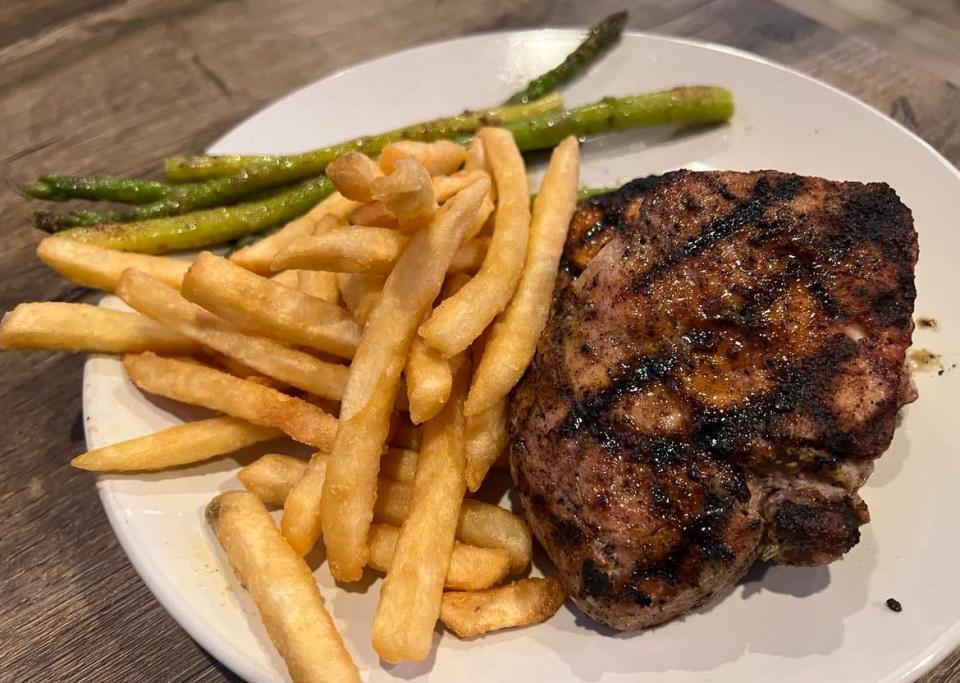 The grilled pork chops are among the tastier dishes at Loby's Grille on CLE in Canton.