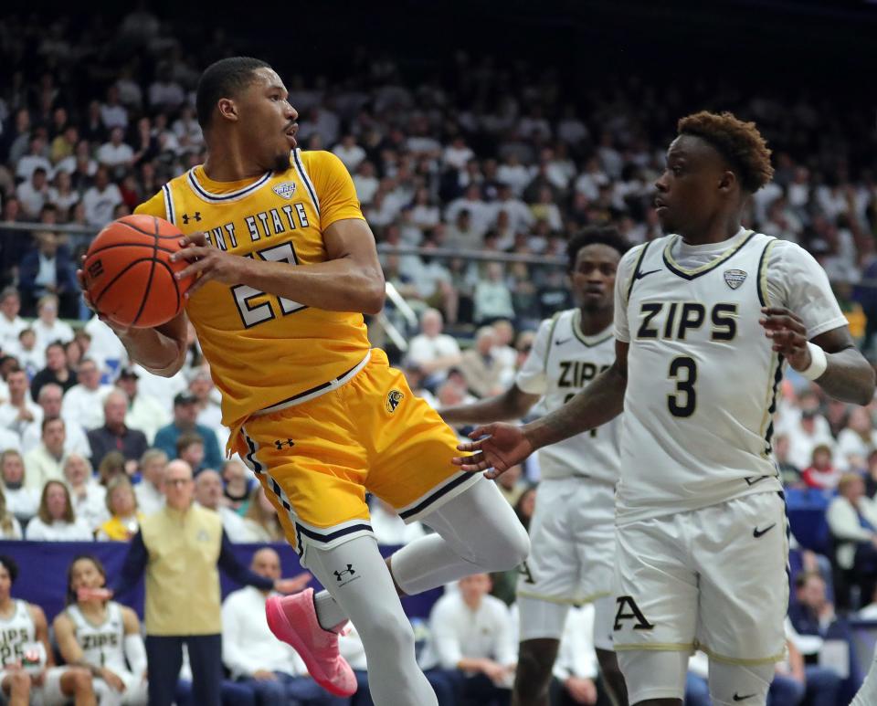 Kent State Golden Flashes guard Tyem Freeman (22) attempts to keep the ball in play against Akron Zips guard Kaleb Thornton (3) during the second half of an NCAA college basketball game, Friday, Feb. 23, 2024, in Akron, Ohio.