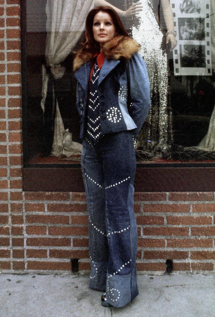 Presley rocked out in a denim outfit as she posed outside her clothing store, Bis & Beau Boutique, in Beverly Hills, California.  (Ron Galella/Getty Images)