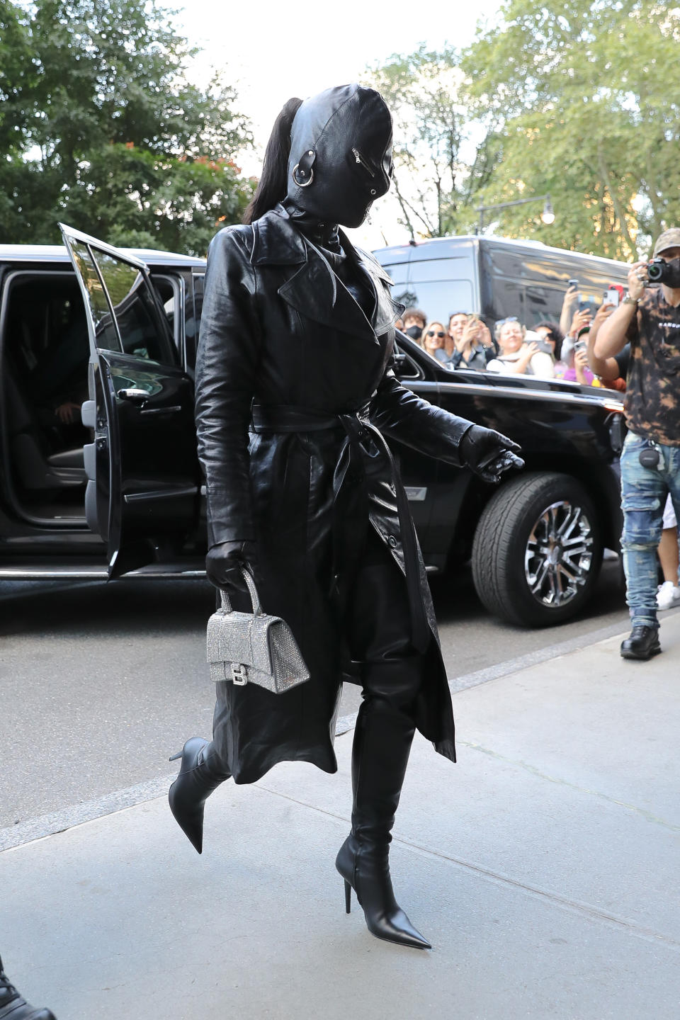 Kim Kardashian covered head-to-toe with a leather suit arrives at her hotel in NYC on Sept. 11, 2021. - Credit: MEGA