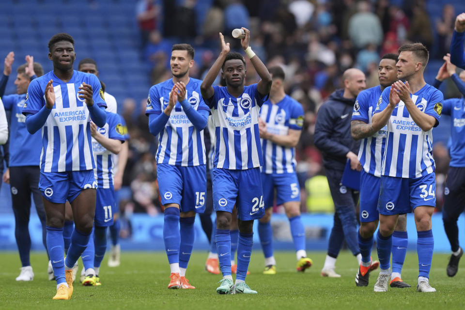 Brighton and Hove Albion players celebrate after winning the Premier League match between Brighton & Hove Albion and Aston Villa, at the American Express Stadium in Brighton, England, Sunday May 5, 2024. (Gareth Fuller/PA via AP)