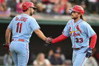 St. Louis Cardinals' Brendan Donovan, right, is congratulated by Paul DeJong after hitting a solo home run off Cleveland Guardians starting pitcher Tanner Bibee during the second inning of a baseball game, Saturday, May 27, 2023, in Cleveland. (AP Photo/David Dermer)