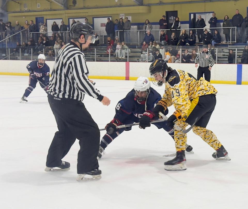 The Lancers' Danny Greenhall battles in a face off against Wall's Jack Findley.