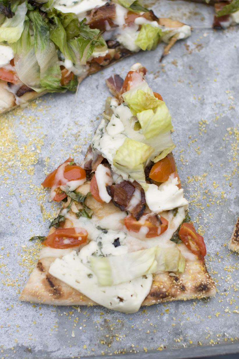 This July 22, 2013 photo taken in Concord, N.H., shows a recipe for grilled BLT pizza with summer tomato-basil sauce. (AP Photo/Matthew Mead)