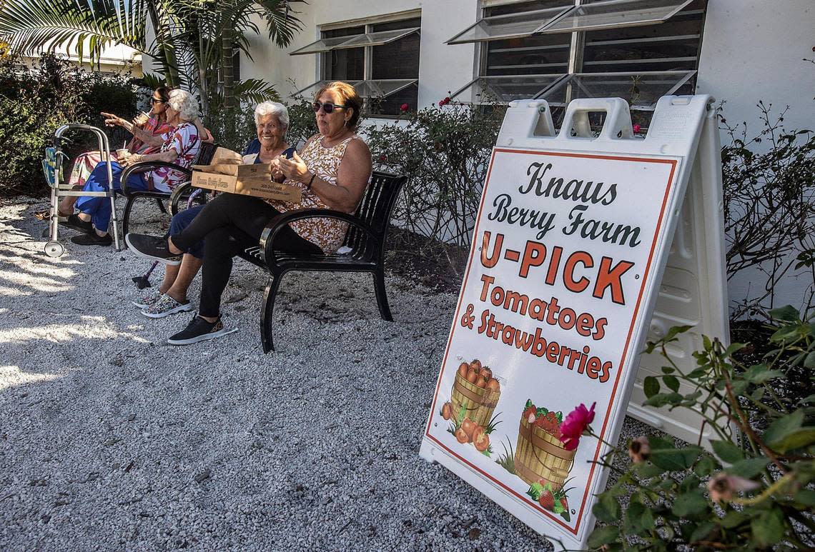 Customers of 20 years, Nora Pinger, right, and Dora Lopez enjoy eating the famous homemade cinnamon rolls at Knaus Berry Farm in Homestead on Feb. 24, 2023. The business has been owned and operated by the Knaus family since 1956.