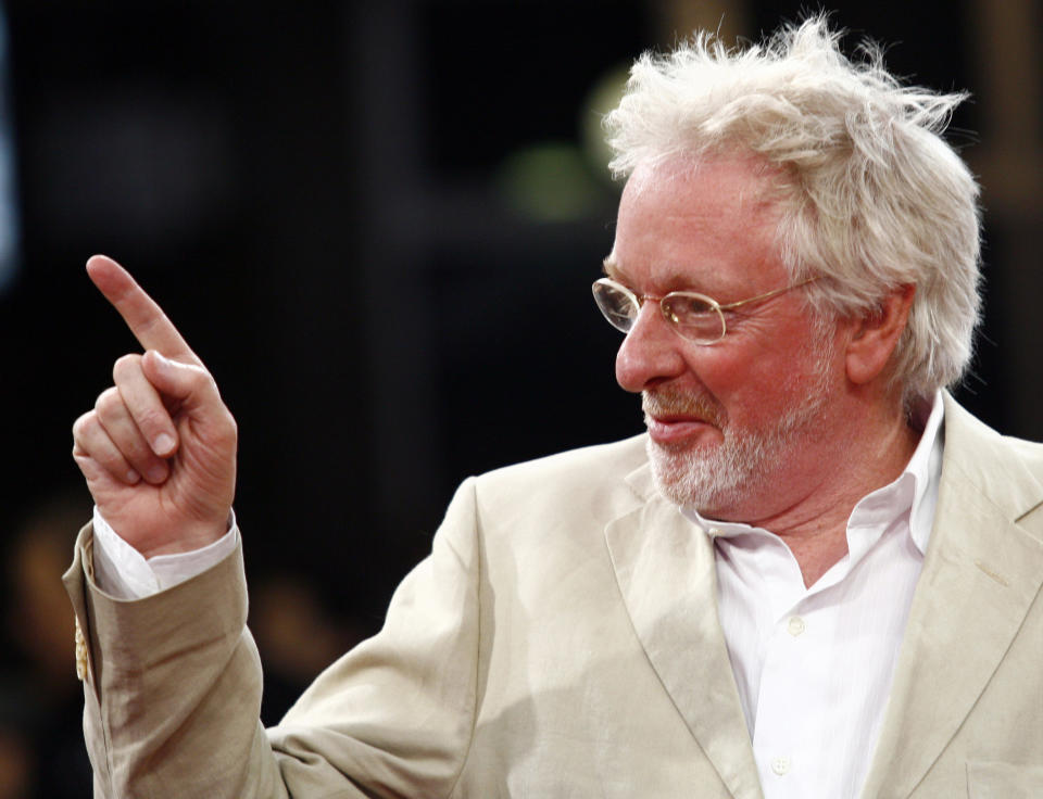 British oscar wininng director Hugh Hudson gestures in the Bosnian National Theatre during the closing ceremony of 14th Sarajevo Film Festival, in Sarajevo, on Saturday, Aug. 23, 2008. (AP Photo/Hidajet Delic)