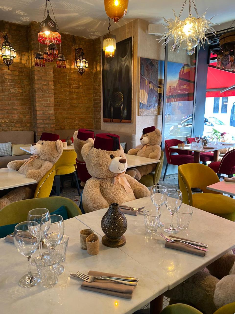 Cuddly toy bears sit in seats at Tagine in Balham to enforce social distancing at the restaurant