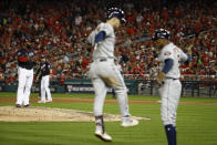 Houston Astros' Alex Bregman rounds the bases after a grand slam off Washington Nationals relief pitcher Fernando Rodney during the seventh inning of Game 4 of the baseball World Series Saturday, Oct. 26, 2019, in Washington. (AP Photo/Patrick Semansky)