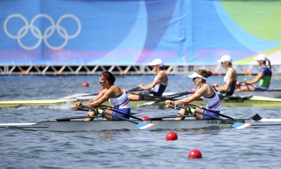 2016 Rio Olympics - Rowing - Preliminary - Women&#39;s Double Sculls Heats - Lagoa Stadium - Rio De Janeiro, Brazil - Helene Lefebvre (FRA) of France and Elodie Ravera-Scaramozzino (FRA) of France compete. REUTERS/Carlos Barria FOR EDITORIAL USE ONLY. NOT FOR SALE FOR MARKETING OR ADVERTISING CAMPAIGNS.