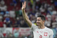 Poland's Robert Lewandowski waves after the World Cup round of 16 soccer match between France and Poland, at the Al Thumama Stadium in Doha, Qatar, Sunday, Dec. 4, 2022. (AP Photo/Ricardo Mazalan)