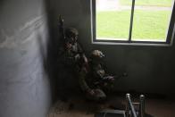 U.S. soldiers from 2nd Infantry Division, participate in a UFS/TIGER Combined Urban Operations plan as part of Ulchi Freedom Shield (UFS) exercises at Wollong Urban Area Operatiions training center, Wednesday, Aug. 23, 2023 on Paju in Gyeonggi-do, South Korea. (Jeon Heion-Kyun/EPA via AP, Pool)