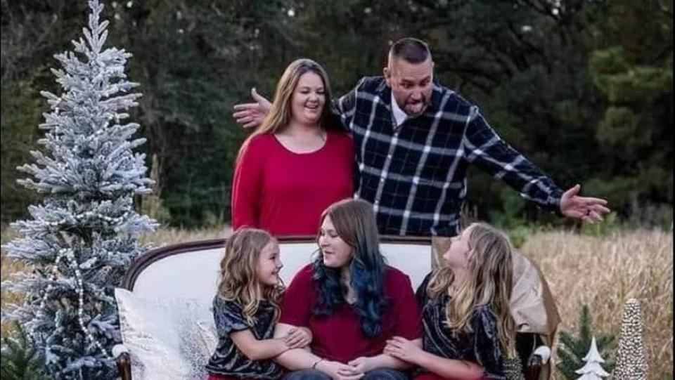 George County Sheriff’s Deputy Jeremy Malone is pictured with his wife and children.