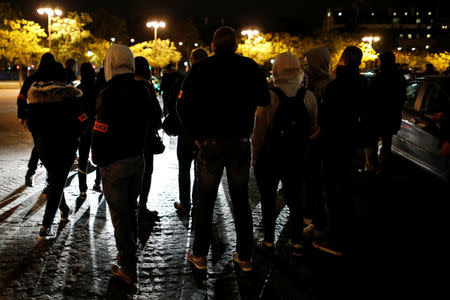 French plainclothes policemen gather during an unauthorised protest against anti-police violence on the Champs Elysees in Paris, France, early October 20, 2016. REUTERS/Benoit Tessier