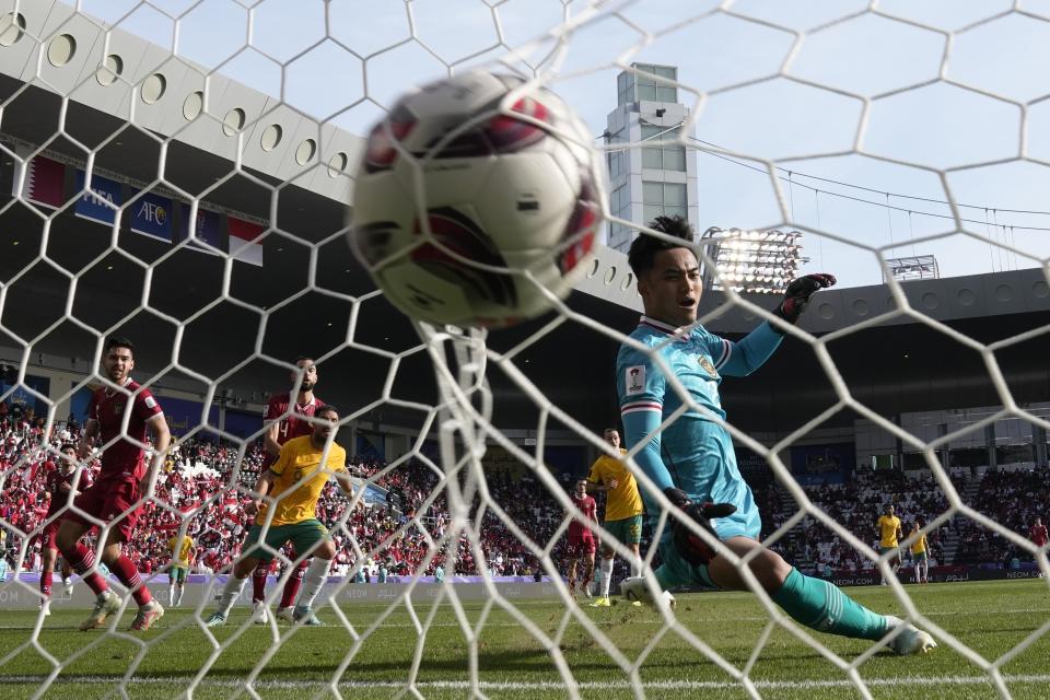 Indonesia's goalkeeper Ernando Ari Sutaryadi receives his second goal during the Asian Cup round of 16 soccer match between Australia and Indonesia at Jassim Bin Hamad Stadium in Doha, Qatar, Sunday, Jan. 28, 2024. (AP Photo/Aijaz Rahi)