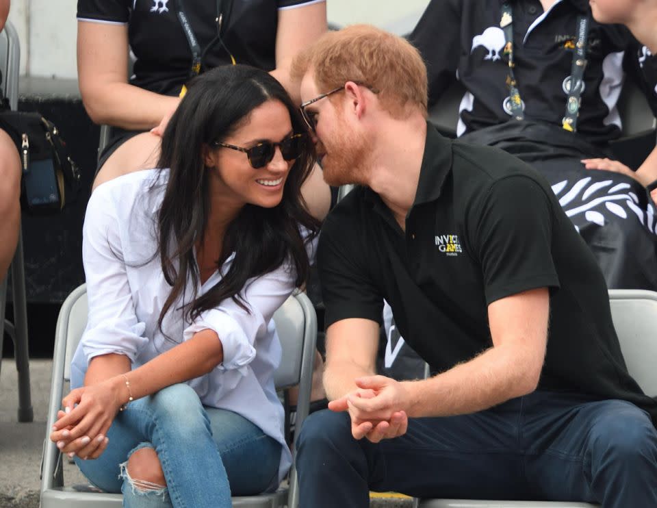 Harry and Meghan were seen getting cosy at the Invictus Games. Photo: Getty