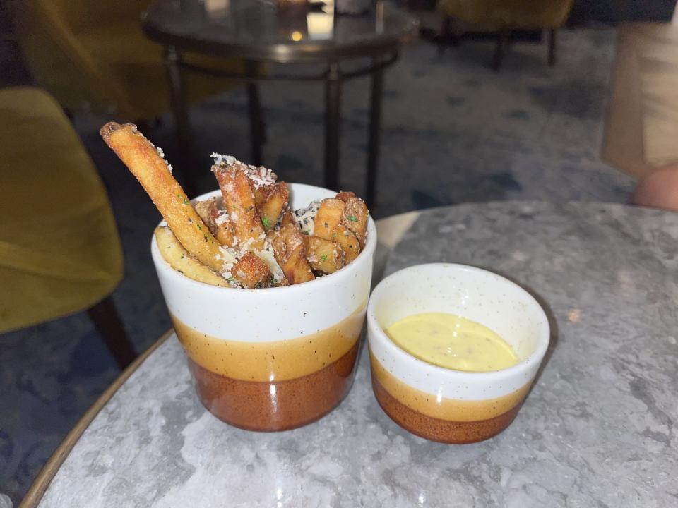 Cup of truffle fries and side of aioli.