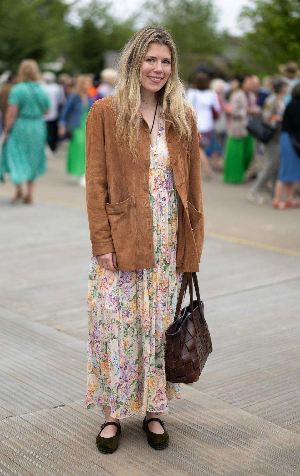 Charlotte Ford, 36, wears a suede jacket from Sezane with a floral dress by Zimmermann. Her flat shoes are Vibi Venezia and her bag is Dragon Diffusion