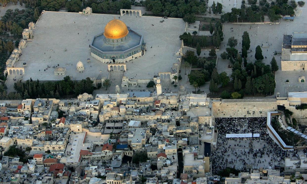 The golden Dome of the Rock Islamic shrine, a holy site for Muslims, stands close to the Western Wall, Judaism's holiest site, in an aerial view of Jerusalem's Old City. <a href="https://www.gettyimages.com/detail/news-photo/the-golden-dome-of-the-rock-islamic-shrine-dominates-the-news-photo/55972333?adppopup=true" rel="nofollow noopener" target="_blank" data-ylk="slk:David Silverman/Getty Images;elm:context_link;itc:0;sec:content-canvas" class="link ">David Silverman/Getty Images </a>