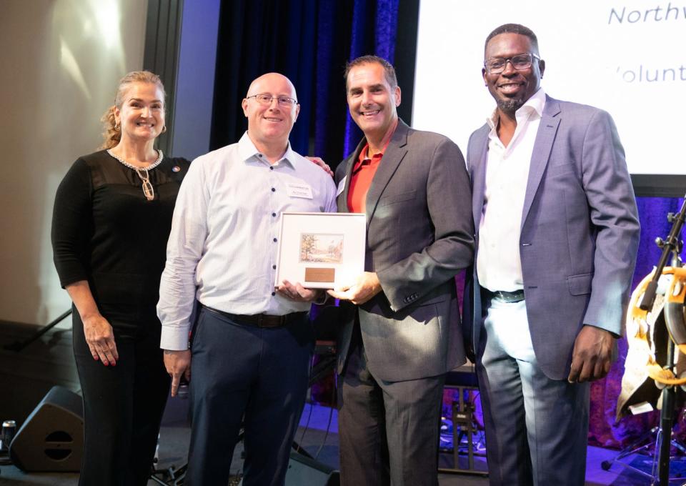 The Chamber Collaborative of Greater Portsmouth's Volunteer of the Year Steve Schwalje received his award from Laura Johnson and Mamadou Dembele of Bangor Savings Bank and Ben VanCamp of the Chamber Collaborative Thursday, Aug. 4, 2022.