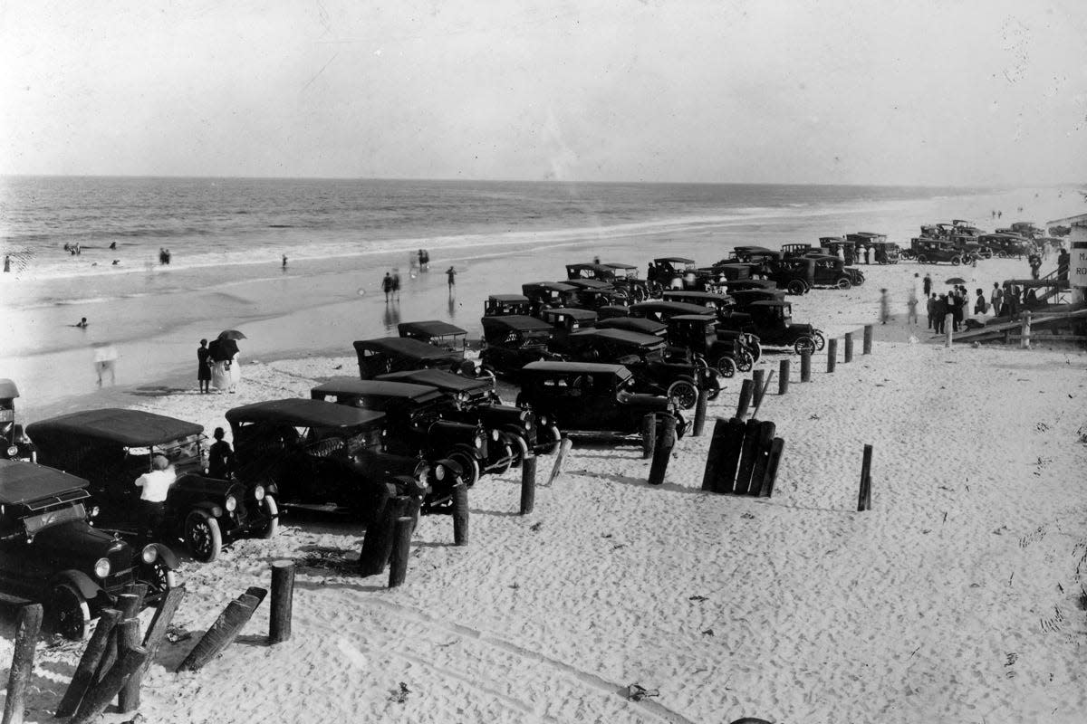 Cars are crowded on American Beach in Nassau County, circa 1937. The seaside recreation area was founded by A.L. Lewis, the state's first Black millionaire and an active philanthropist.