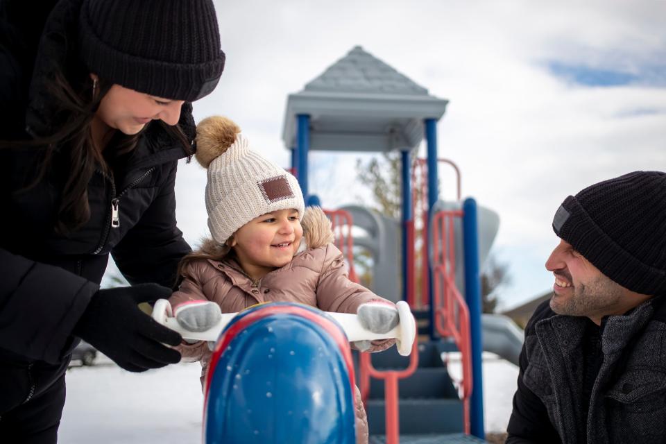 Mario and Jennifer Gonzales play with their 3-year-old daughter, Evelyn, at DeBroux Park in Green Bay. Evelyn, whose mother is white and whose father is Hispanic, is part of northeast Wisconsin's growing mulitracial and mulitethnic population.