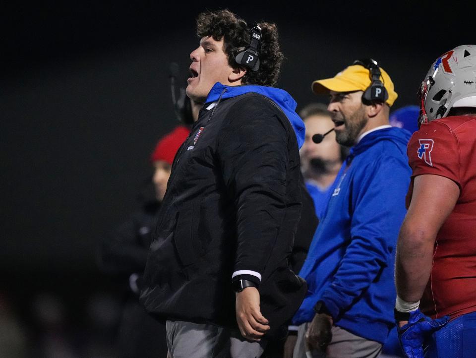 Roncalli Royals head coach Eric Quintana yells to player on the field Friday, Nov 11, 2022 at Roncalli High School in Indianapolis. The Roncalli Royals defeated the New Palestine Dragons, 20-7, for the IHSAA Class 4A regional championship. 