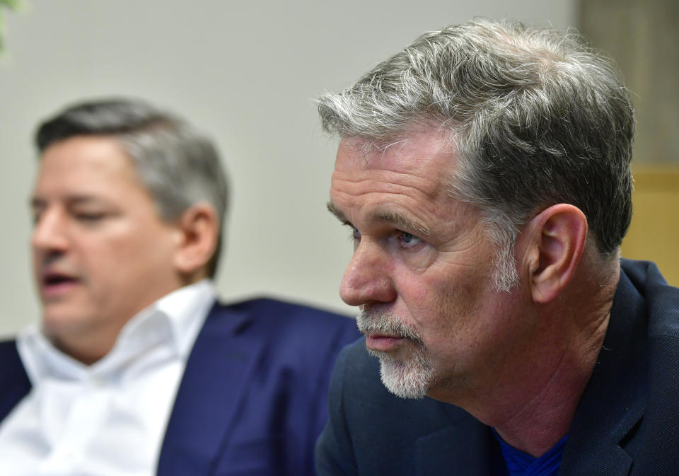 Founder and CEO of Netflix Reed Hastings (R) and Netflix Chief Content Officer Ted Sarandos (L) attend a Netflix event on March 1, 2017 in Berlin.  / AFP PHOTO / John MACDOUGALL        (Photo credit should read JOHN MACDOUGALL/AFP via Getty Images)