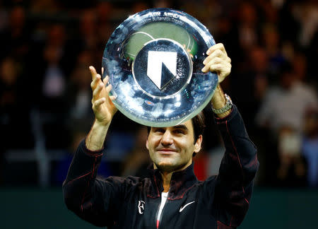 Tennis - ATP 500 - Rotterdam Open - Final - Ahoy, Rotterdam, Netherlands - February 18, 2018 - Roger Federer of Switzerland holds the trophy after winning against Grigor Dimitrov of Bulgaria. REUTERS/Michael Kooren