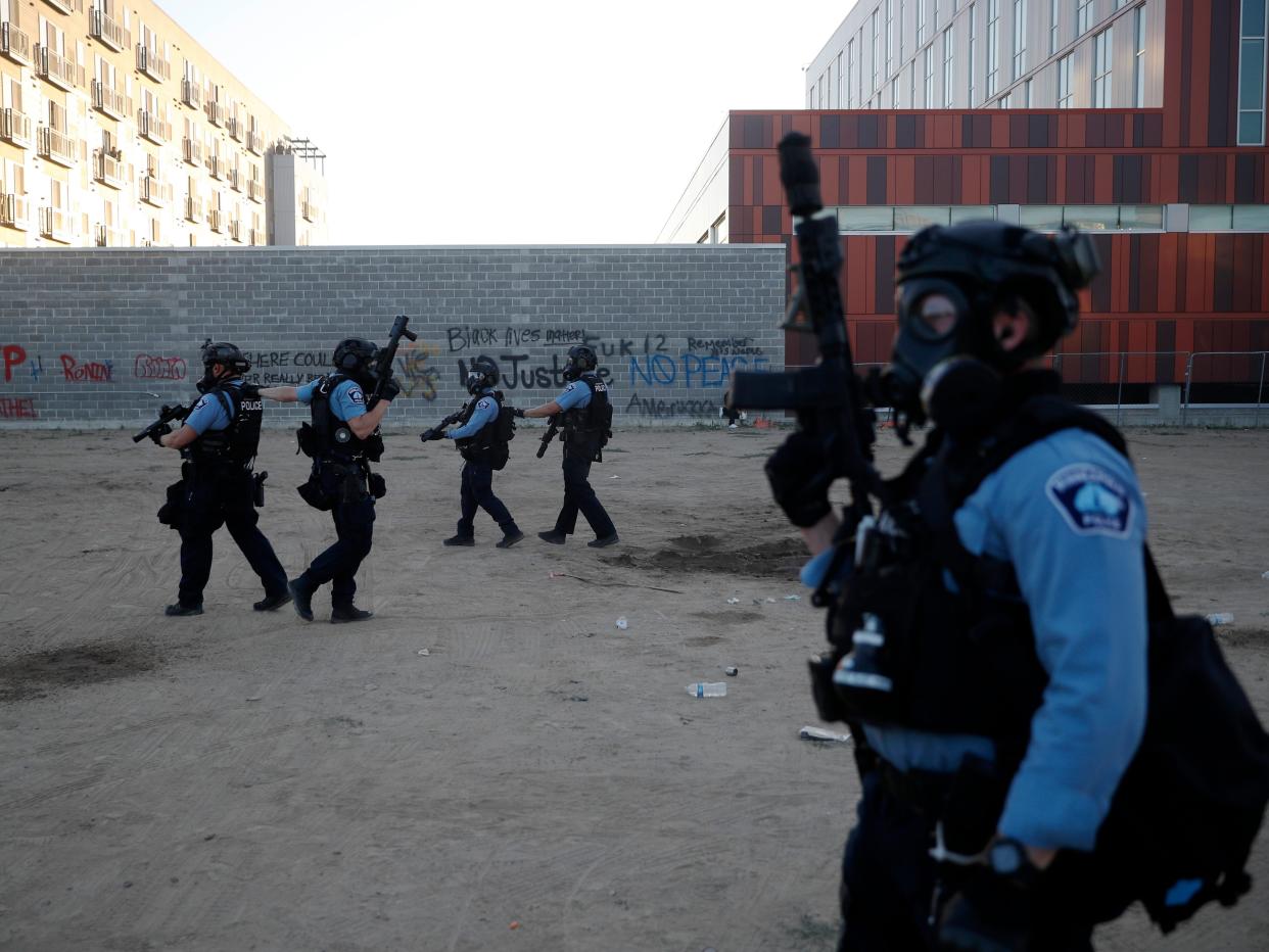 Police prepare and organize to address protesters, Friday, May 29, 2020, in Minneapolis.