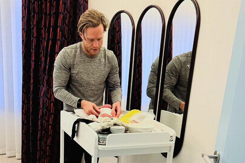 Olly Murs has shared a snap of him changing his baby daughter's nappy after a night on tour