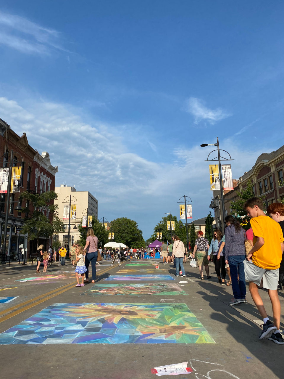 Chalk art pieces along Washington Street are pictured during the sixth Rock the Chalk event on Friday, Aug. 12, 2022.