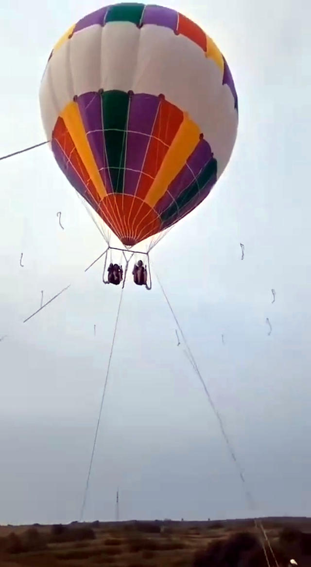 The mum and son floated away after the balloon slipped its moorings. Source: Australscope/AsiaWire