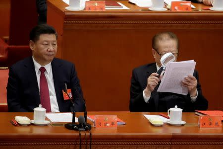 Chinese President Xi Jinping (L) and former Chinese President Jiang Zemin are seen during the closing session of the 19th National Congress of the Communist Party of China at the Great Hall of the People, in Beijing. REUTERS/Jason Lee